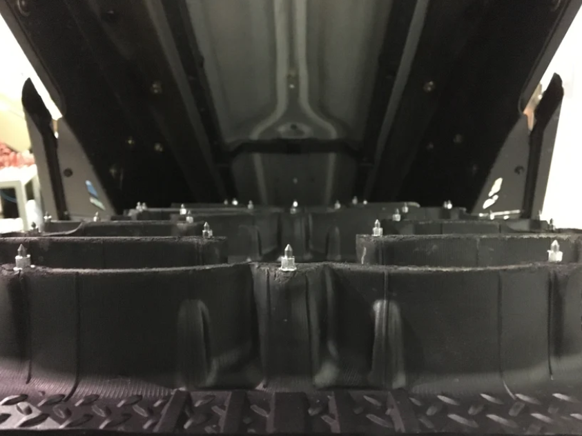 Close-up of iGRiP SS Series snowmobile studs with reinforced carbide tips